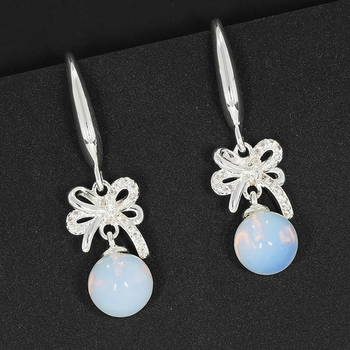 Equilibrium Silver Plated Clear Moonstone Bow Drop Earrings